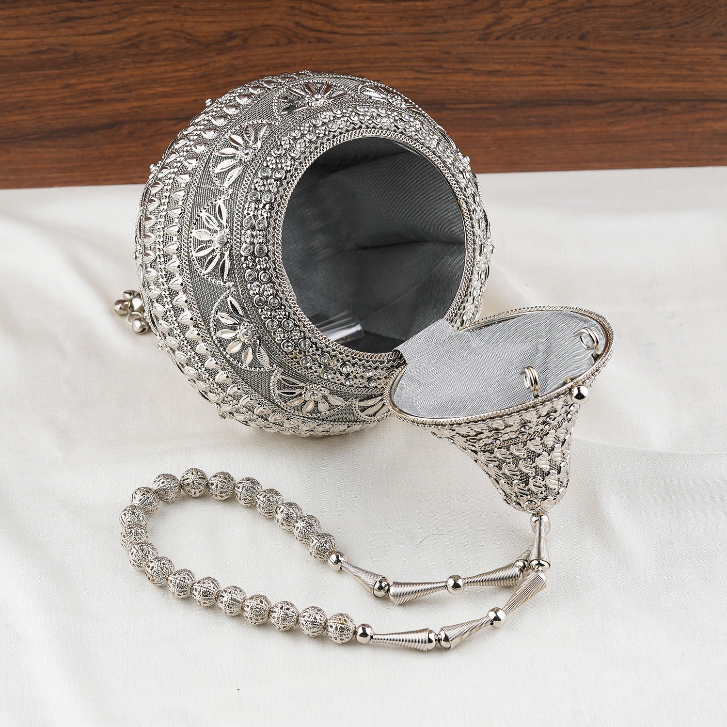 Silver Embellished Shankh Shaped Potli Clutch