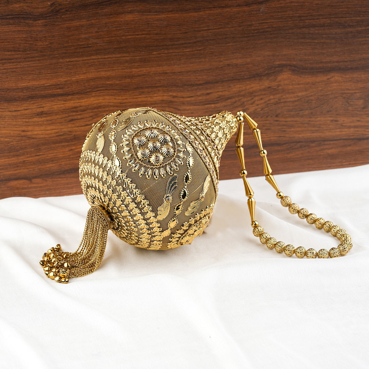 Royal Shankh Shape Golden Handheld Clutch