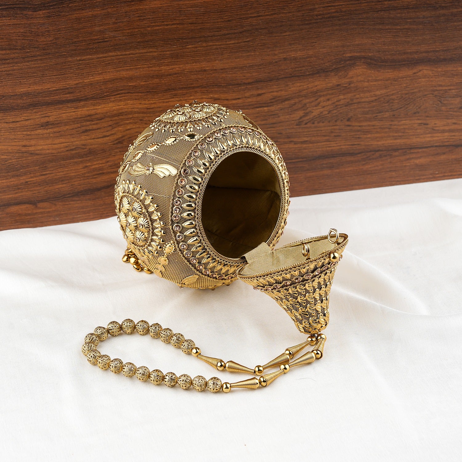 Royal Shankh Shape Golden Handheld Clutch
